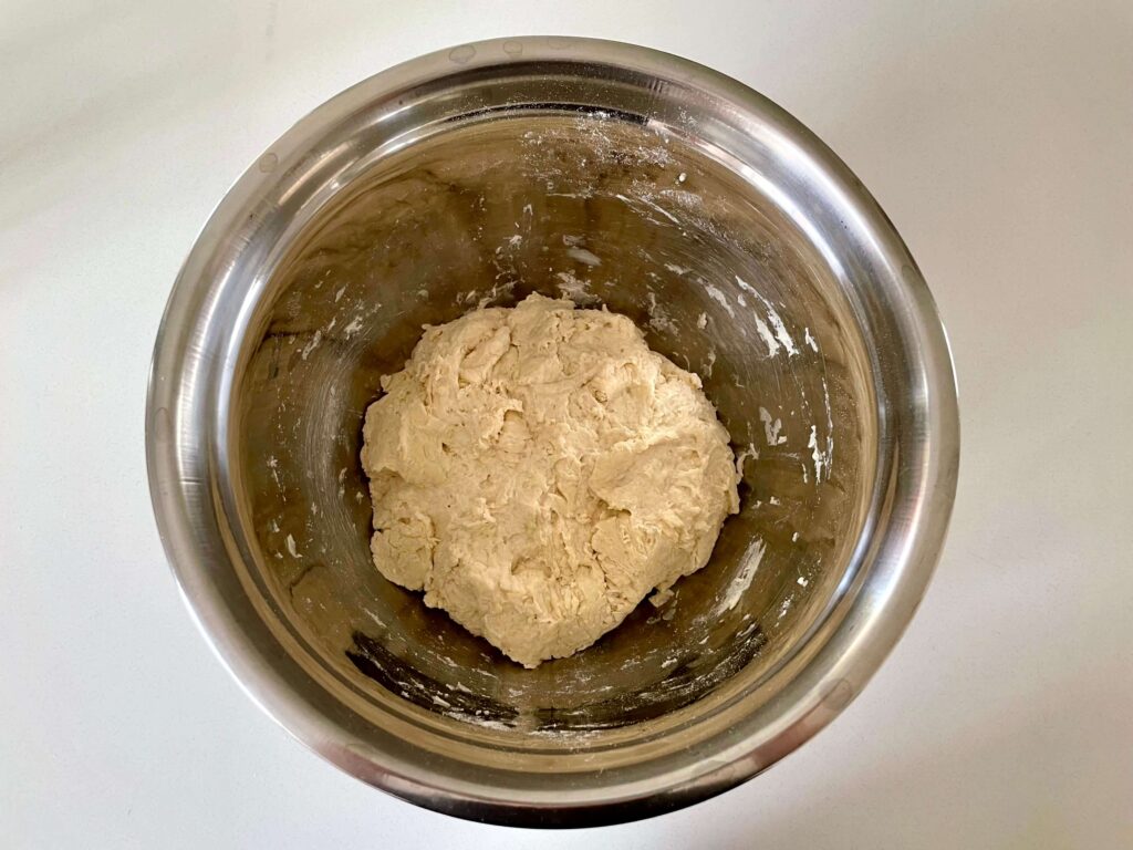 Bread ingredients mixed to form a shaggy dough
