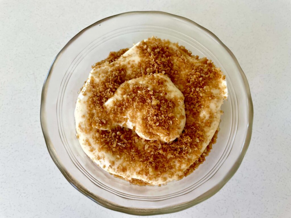 Eggnog cheesecake parfait in a glass bowl