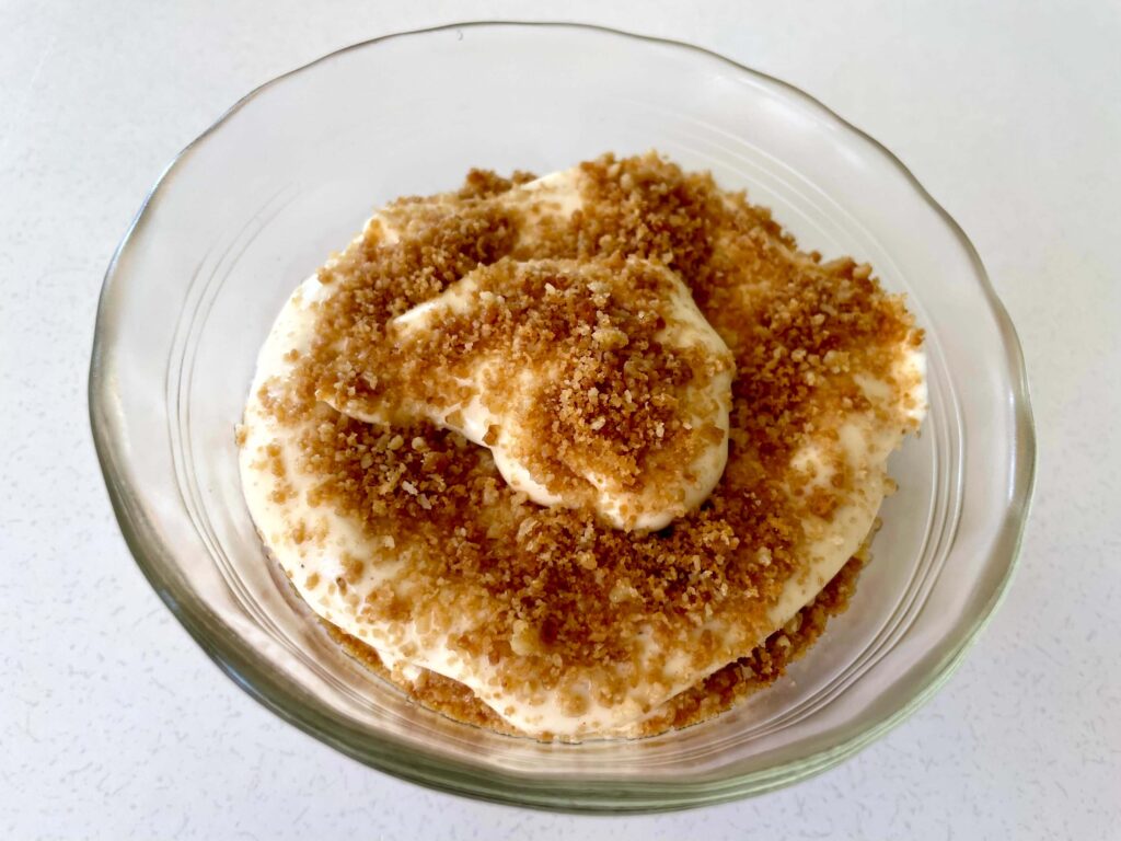 Eggnog cheesecake parfait in a glass bowl