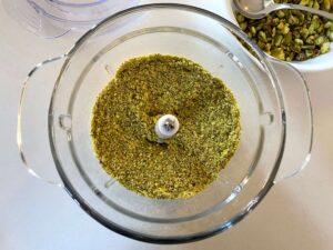 Finely ground pistachios in a food processor