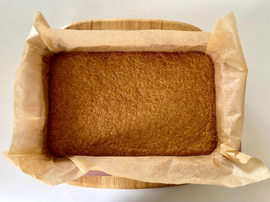 The biscuit base has been baked and is ready for the caramel