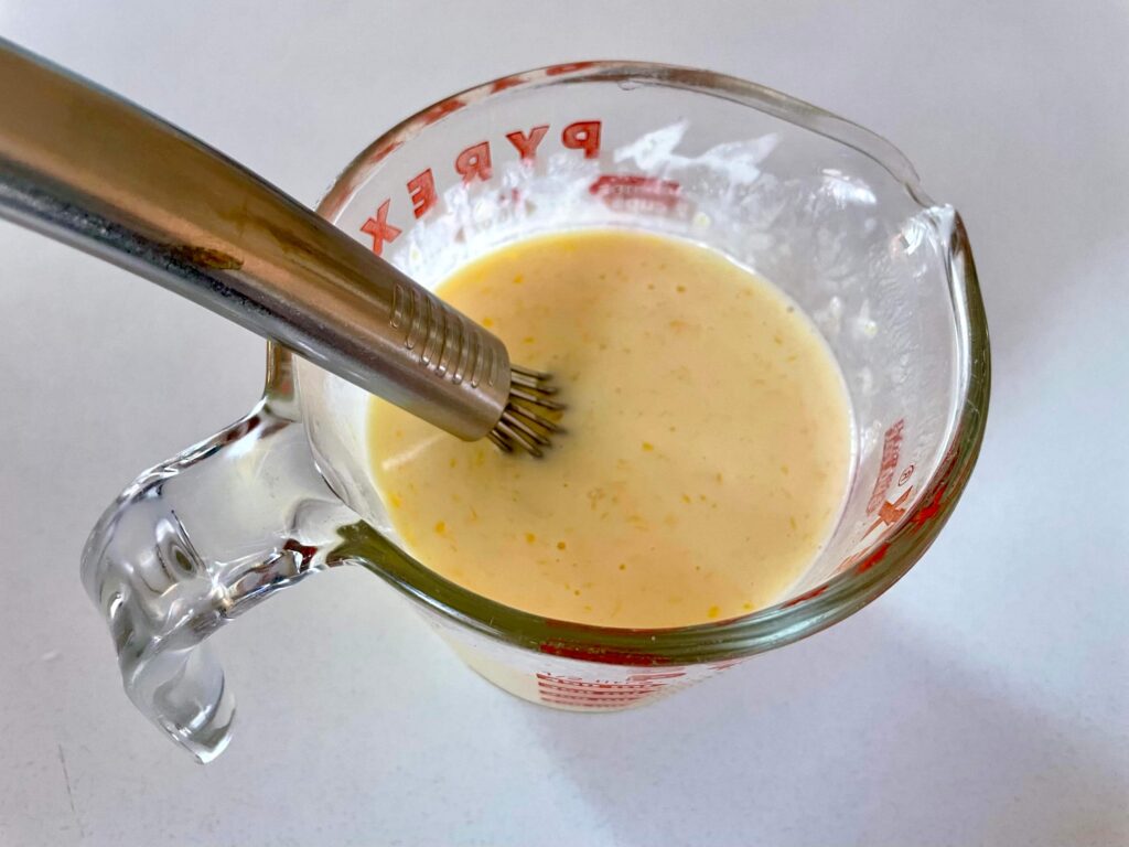 A mixture of buttermilk, egg, and melted butter