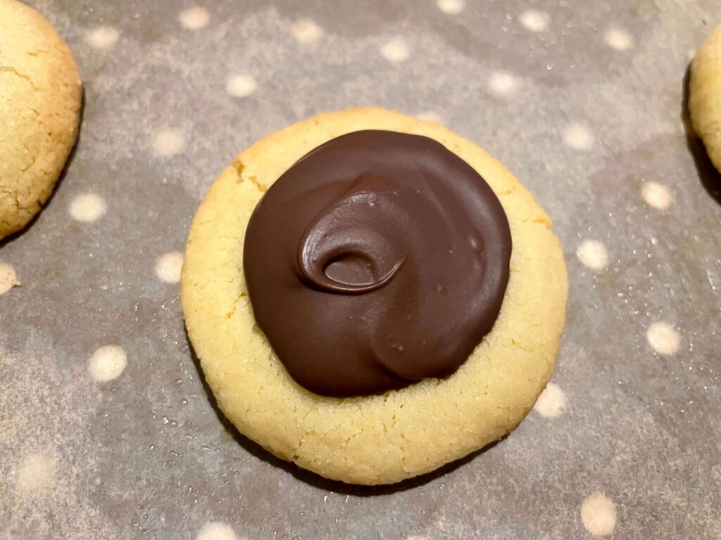 Chocolate caramel thumbprint cookie close up