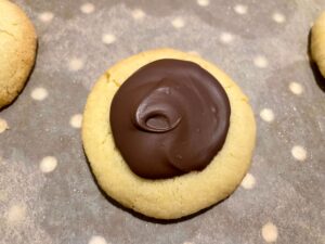 Chocolate caramel thumbprint cookie close up