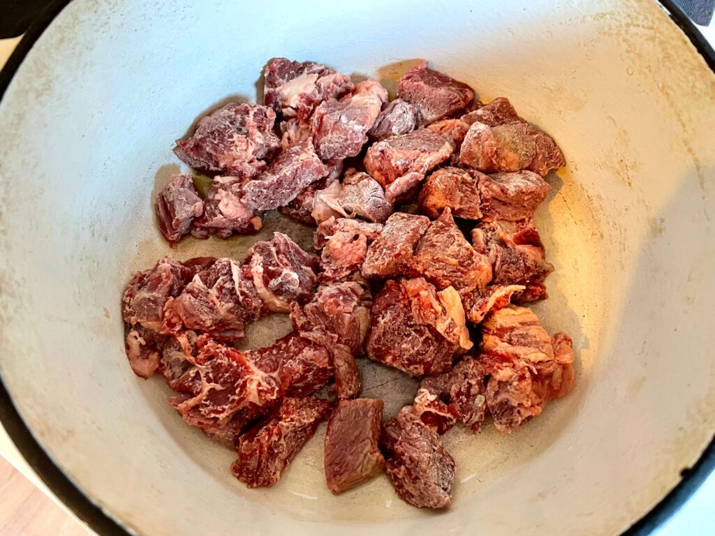 Cubed Chuck Steak in a Dutch Oven on the Stove