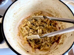 Onions and Celery Softening in a Dutch Oven on the Stove