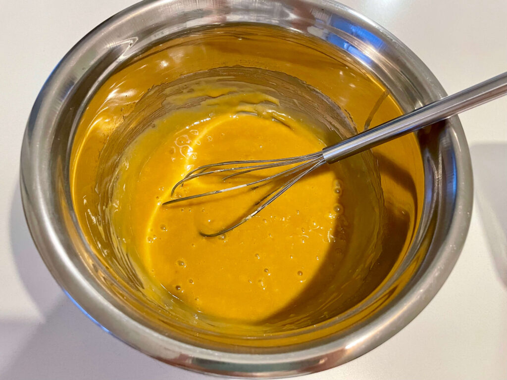 Half of the flour mixed into the wet ingredients